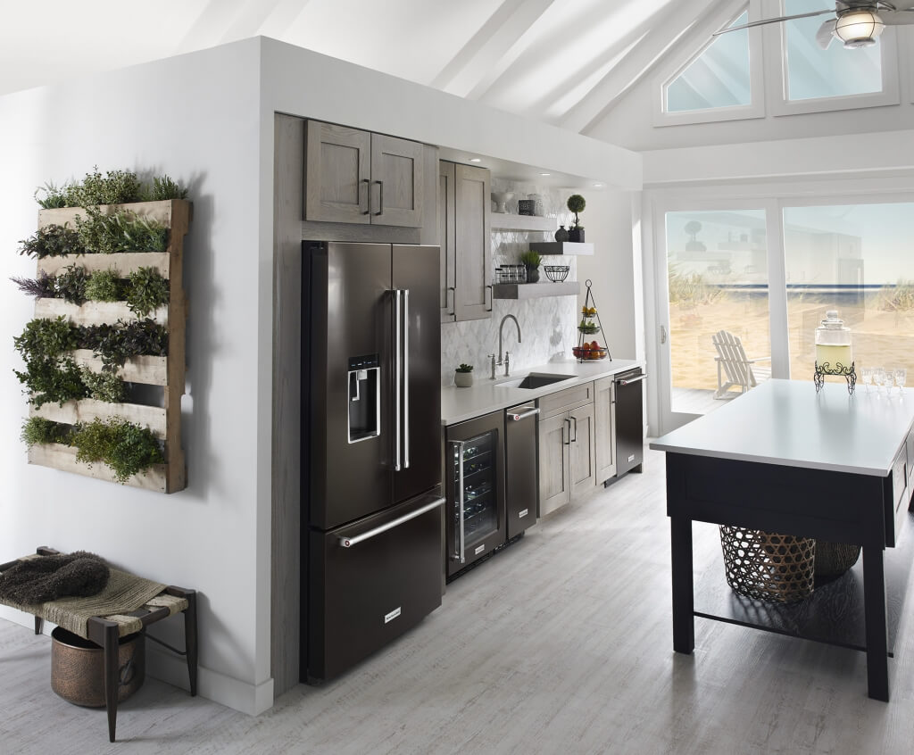 Black Stainless Steel KitchenAid Refrigerator with External Icemaker in Kitchen