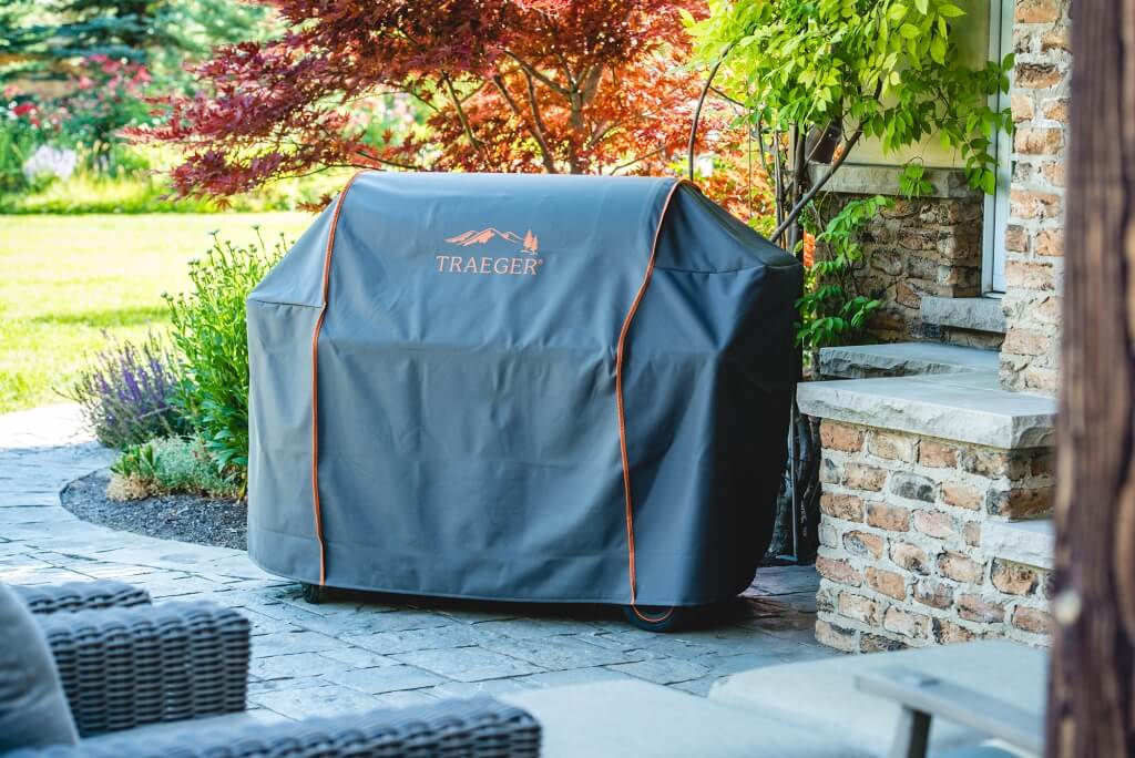 Traeger grill with grill cover on patio