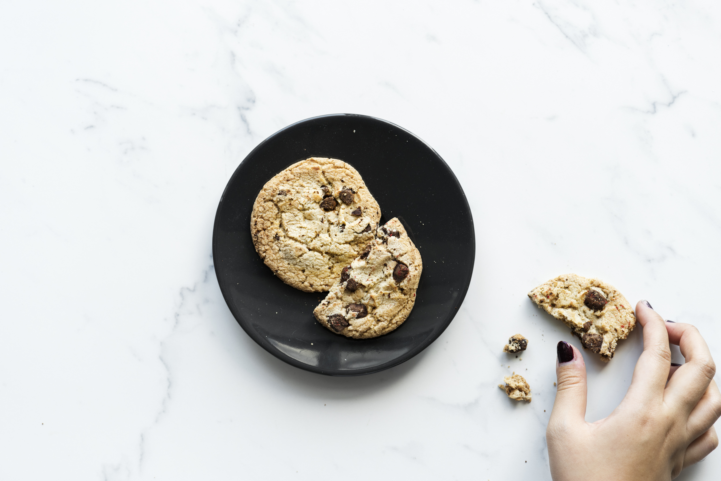 chocolate chip cookies on black plate